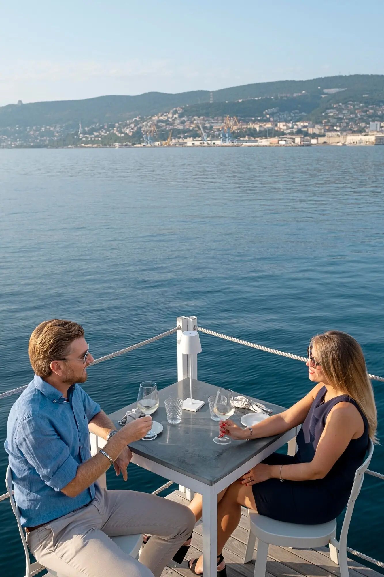 Medium shot of people seated at a table.